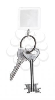 steel keys on keyring with blank keychain isolated on white background