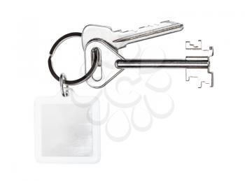 bundle of keys on keyring with blank keychain isolated on white background