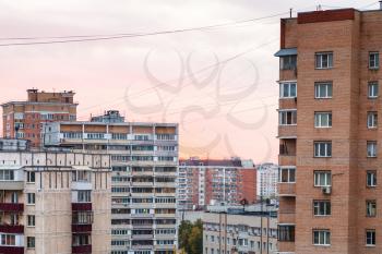 pink sunset sky over residential quarter in Moscow city in autumn evening