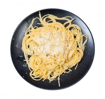 italian cuisine - top view of spaghetti al burro e parmigiano (pasta with butter and cheese) on black plate isolated on white background