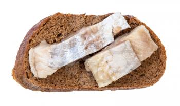 top view of open sandwich with rye bread and pickled herring isolated on white background