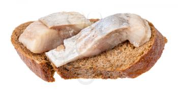 open sandwich with rye bread and pickled herring isolated on white background