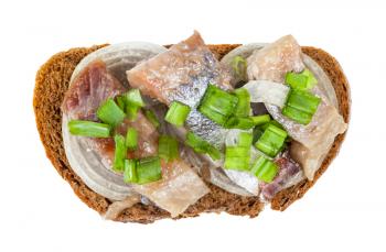 top view of open sandwich with rye bread, pickled herring and onion isolated on white background