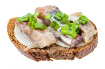 open sandwich with rye bread, pickled herring and onion isolated on white background