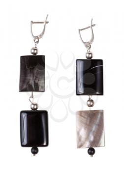 top view of hand crafted silver earrings from polished agate and nacre beads isolated on white background
