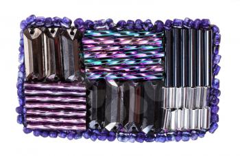 handcrafted rectangular brooch from various purple glass bugles and beads isolated on white background