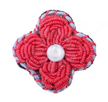 handcrafted flower brooch embroidered by red silk embroidery thread isolated on white background