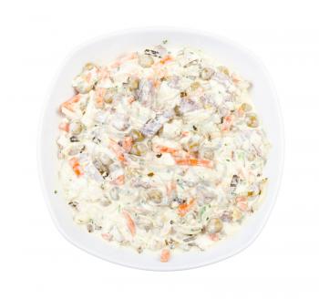 top view of portion of russian Olivier salad in white bowl isolated on white background