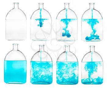 set of blue ink solutions in water in glass flask isolated on white background