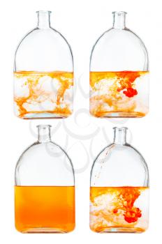 set of orange ink solutions in water in glass flask isolated on white background