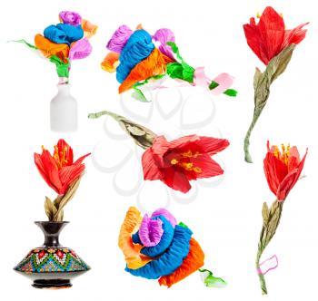 set of artificial multicolored flowers made of crepe papers isolated on white background
