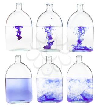 set of violet ink solutions in water in glass flask isolated on white background