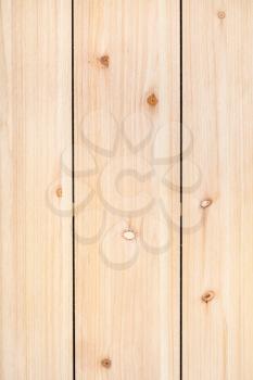 vertical wooden background - unpainted wood panel from three vertical pine planks