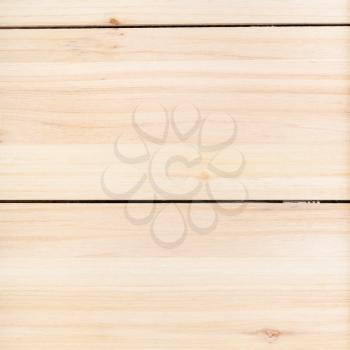 square wooden background - unpainted wood board from horizontal wide pine planks close up