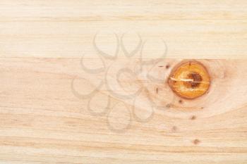 horizontal wooden background - unpainted wood board from two pine planks with knot close up