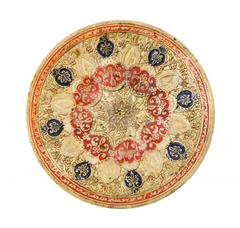 top view of vintage indian handcrafted embossed brass plate isolated on white background handmade made in the middle of the 20th century