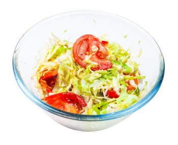vegetable salad from fresh chopped tomatoes and shredded cabbage in glass bowl isolated on white background