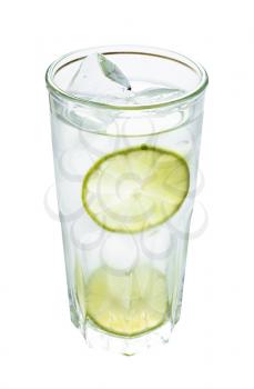 highball glass with prepared gin and tonic cocktail on the rock with two slices of lime isolated on white background