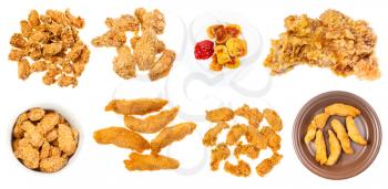 collection of various deep fried chicken pieces (nuggets, strips, wings, etc) isolated on white background