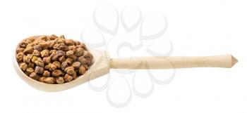raw black chickpeas in wooden spoon isolated on white background