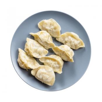 top view of several boiled dumplings on gray plate isolated on white background