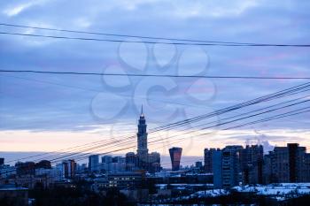 dark blue clouds over residential district in Moscow city at dusk