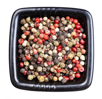 top view of Four Pepper Blend peppercorns in black bowl isolated on white background