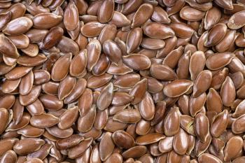 food background - many brown flax seeds