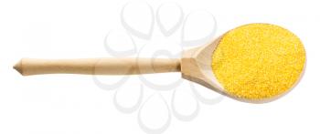 wooden spoon with uncooked polenta fine cornmeal isolated on white background