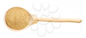 top view of wood spoon with raw amaranth grains isolated on white background
