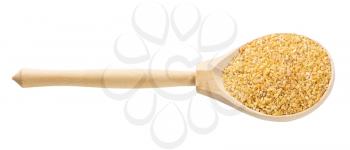 wooden spoon with crushed polished wheat grains isolated on white background