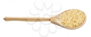 wooden spoon with raw parboiled long-grain rice isolated on white background