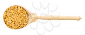 top view of wood spoon with golden flax seeds isolated on white background