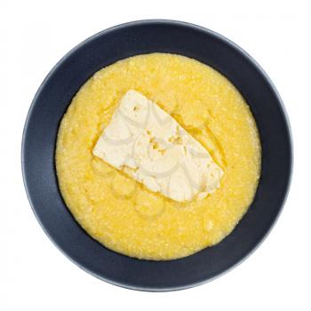 top view of cooked cornmeal porridge with piece of brined cheese in gray bowl isolated on white background