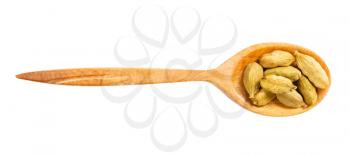 top view of wood spoon with cardamom seeds isolated on white background
