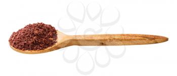 wooden spoon with ground sumac isolated on white background