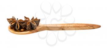 wooden spoon with star anise (badian) isolated on white background