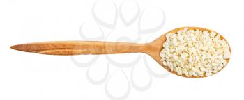 top view of wood spoon with raw white sesame seeds isolated on white background