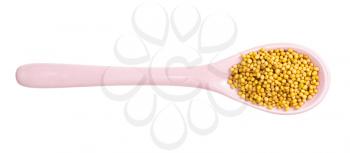 top view of ceramic spoon with yellow seeds of brassica juncea mustard isolated on white background