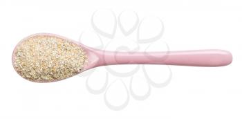 top view of ceramic spoon with rye bran isolated on white background