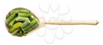 top view of cut and frozen green beans in wood spoon isolated on white background