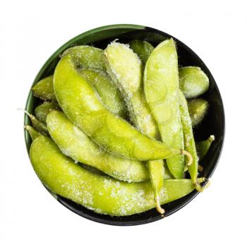 top view of frozen Edamame (unripe soybeans) pods in round bowl isolated on white background