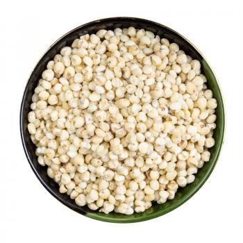 top view of raw polished Sorghum groats in round bowl isolated on white background
