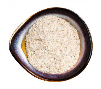 top view of psyllium husk in ceramic bowl isolated on white background