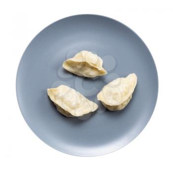 top view of few boiled dumplings on gray plate isolated on white background