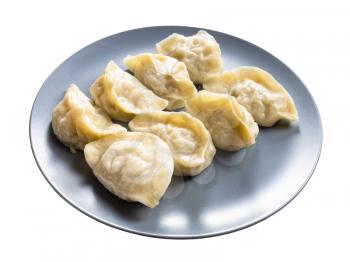 several boiled dumplings on gray plate isolated on white background