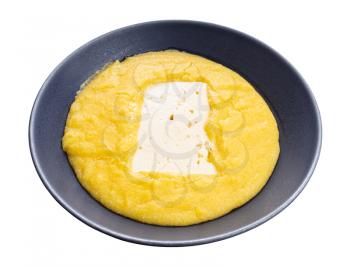 cooked polenta with piece of brined cheese in gray bowl isolated on white background