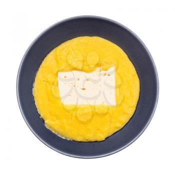 top view of cooked maize porridge with piece of brined cheese in gray bowl isolated on white background
