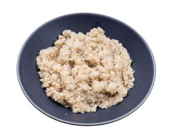 porridge from crushed pot barley groats in gray bowl isolated on white background