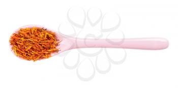 top view of dried safflower petals in ceramic spoon isolated on white background